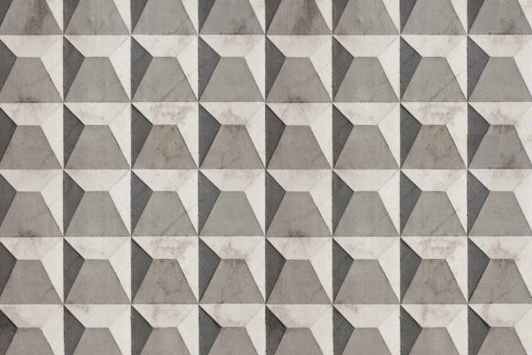 A seamlessly repeating geometric pattern featuring three-dimensional gray, white, and black triangular shapes arranged in a tessellating design creates an illusion of depth.