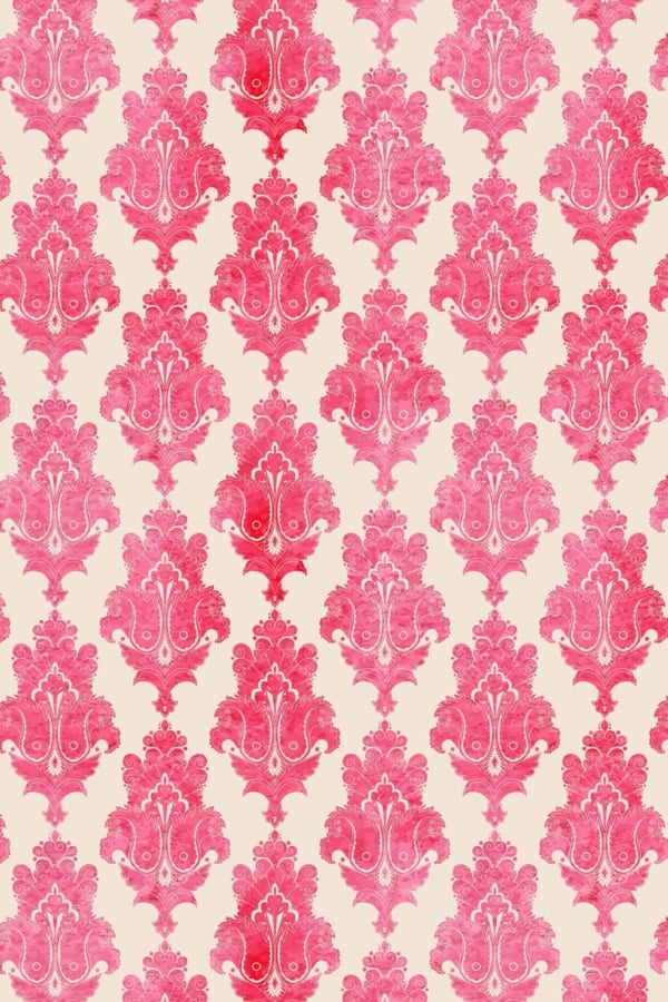 Vintage-style Samira damask wallpaper; intricate floral motifs; shades of pink and red; cream background; symmetrically repeated design.