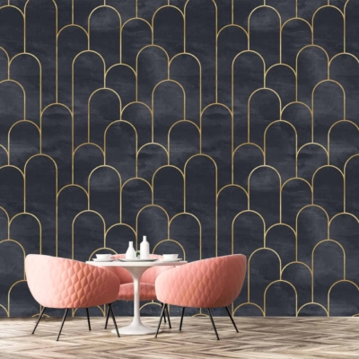 A stylish room features a striking dark wall adorned with a modern gold arch pattern. The wallpaper blends deep, rich hues with sleek, metallic gold accents forming graceful arches.