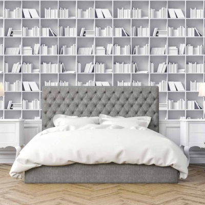The wallpaper consists of white bookshelves filled with uniformly arranged books. The books create a pattern of linear rows and vertical columns that add a structured yet cozy aesthetic to the room. The overall color is white, enhancing a sense of tranquility and order.