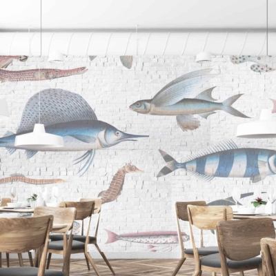 The wallpaper is a large mural featuring various fish, including a swordfish swimming upstream and flying fish. It incorporates marine themes with elements of underwater life. The colors are primarily shades of blue, white, and subtle grays to evoke oceanic scenery against the white brick backdrop.