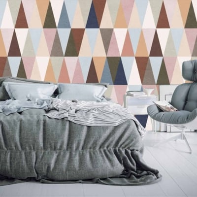 A vibrant geometric accent wall adorned with multicolored triangles, reminiscent of *This is Us*.