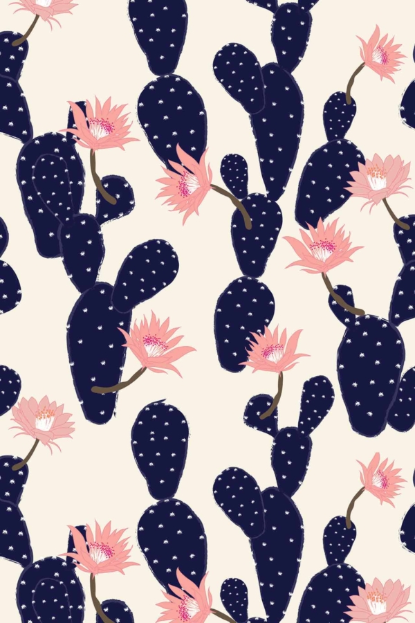 Seamless pattern wallpaper features dark blue cacti with white spots, blooming pink flowers, and a light beige background. Vivid floral elements in tickled pink contrast sharply for a bold design.