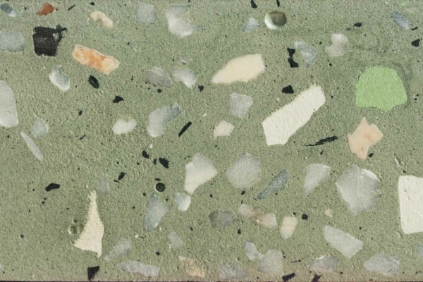 A close-up wallpaper of a terrazzo surface with a green cement matrix, featuring variously sized and colored stone and marble chips. Shades of white, black, gray, and peach create a speckled, mosaic-like pattern. Ideal for a vintage art aesthetic.
**Elements & Colors:**
- Green cement matrix
- Stone & marble chips
- Various sizes
- Colors: White, Black, Gray, Peach
- Speckled pattern
- Mosaic-like design