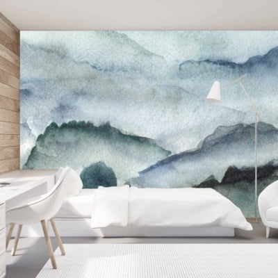 A modern bedroom features a wall mural with abstract blue and green mountains, resembling erosion by time. Colors: blue, green, abstract.
