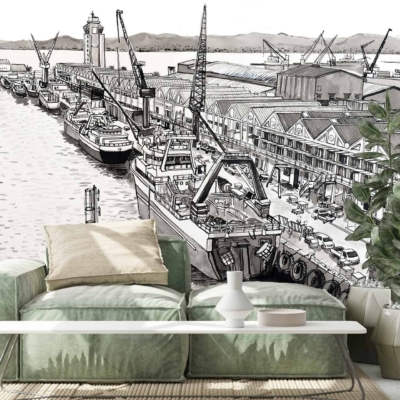 A modern living room featuring a black and white mural of Cape Town's bustling harbour. The wallpaper showcases intricate details of cranes, ships, and the busy port scene. The monochrome tones create a striking contrast, emphasizing the dynamic activity of the harbour. Black and white elements dominate this captivating wallpaper design.