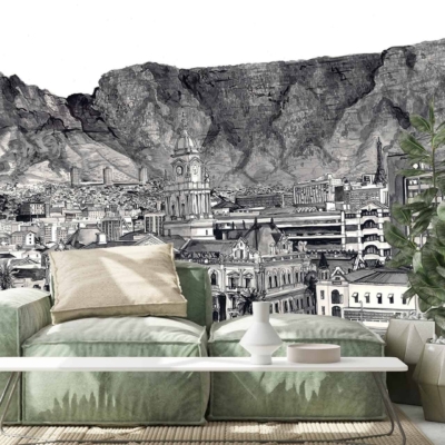 A monochrome mural wallpaper depicting a detailed cityscape with towering mountains in the background. The design blends urban elements with natural landscapes, featuring shades of grey to create a grand and intricate backdrop.