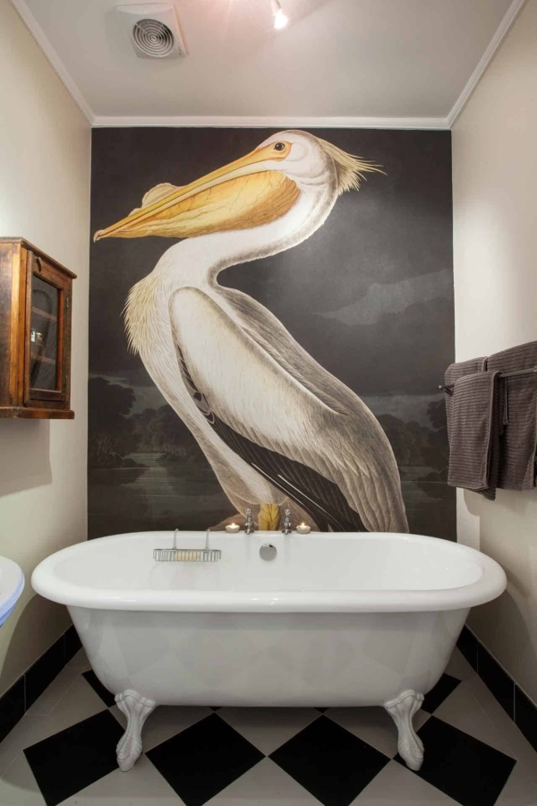 Mural: Large pelican, dark cloudy sky. Colors: White, grey, black.