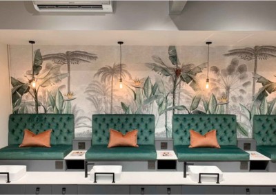 Tropical-themed wallpaper features lush green palm leaves and vibrant orange hibiscus flowers, set against a rich navy blue background, accented with gold veining for an upscale touch. Ideal keywords: tropical wallpaper, green palm leaves, orange hibiscus, navy blue background, gold accents.