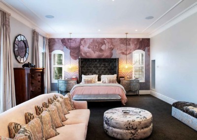 The floral accent wall showcases a stunning combination of delicate pink blossoms, lush green leaves, and intricate vine patterns set against a creamy off-white background. The soft hues of blush, rose, and pastel greens create an elegant harmony that exudes modern sophistication. Ideal for adding a touch of nature-inspired beauty to any portfolio.