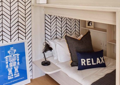 The wallpaper features a striking black and white herringbone pattern.
