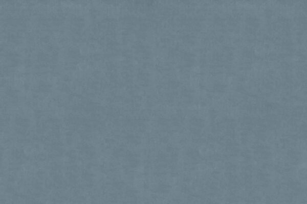 A textured blue background with a soft, muted appearance. The surface features a subtle, evenly distributed pattern, reminiscent of fabric or a lightly clouded sky. Elements: texture, soft blue hue, calming and serene effect. Keywords: textured blue background, muted appearance, fabric-like pattern, calming wallpaper.