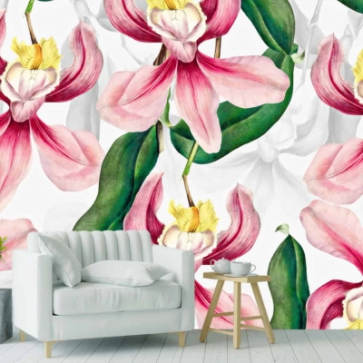 Vibrant pink and yellow orchids with green leaves.