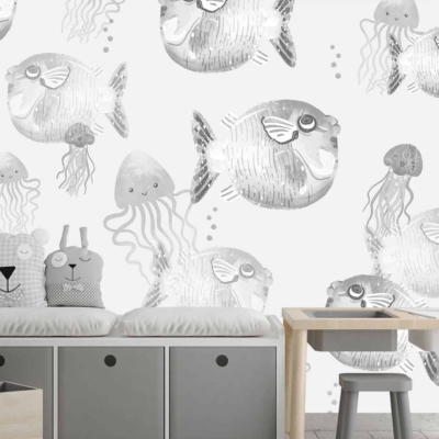 Wall decorated with playful, hand-drawn sea creatures: jellyfish and pufferfish. White and grey tones.