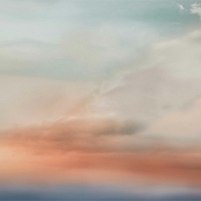 Pastel-toned sky wallpaper features serene gradients of blue, pink, and soft orange. Delicate, wispy clouds enhance the tranquil sunrise or sunset atmosphere. Dreamy and soothing patterns evoke a calm ambiance perfect for peaceful settings.