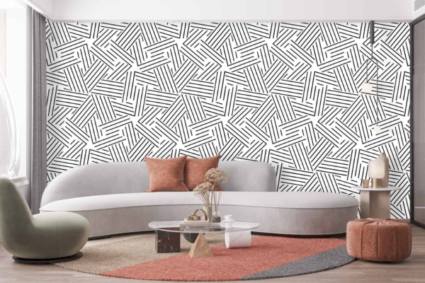 The wallpaper behind the sofa features stacked black-and-white stripes.