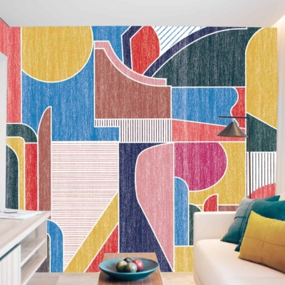 A modern room's wall is adorned with a tailor-made, colorful abstract mural. This eye-catching wallpaper features geometric shapes in bold blue, yellow, red, and green hues.