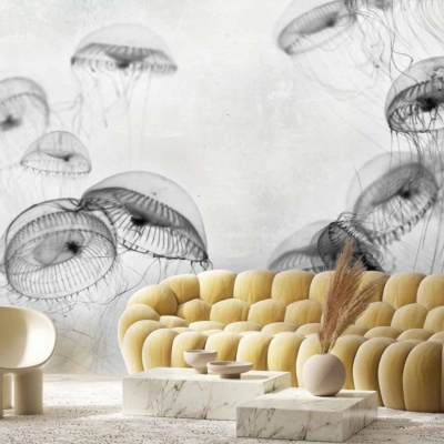The wallpaper features translucent jellyfish swimming gracefully, creating an ethereal, aquatic ambiance. Elements include delicate tentacles and softly glowing bell-shaped bodies. The primary colors are shades of blue and aqua, with subtle hints of luminescent white and soft coral highlights. This dynamic composition gives the impression of movement and tranquility within an underwater scene.