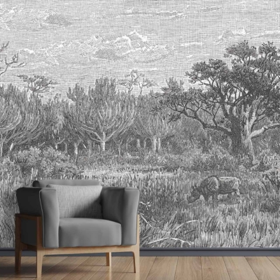 The wallpaper in the modern living room features a large, detailed black-and-white mural. It depicts a serene forest scene with trees, various types of foliage, and grazing animals. The intricate design captures elements of nature in tranquil detail.