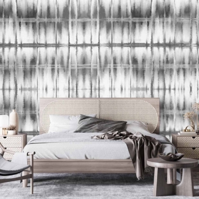 The modern bedroom features a gray and white abstract wallpaper. The wallpaper showcases intricate swirling patterns, combining shades of light and dark gray with crisp white accents. It combines geometric shapes with fluid designs, giving it both a contemporary and dynamic feel.