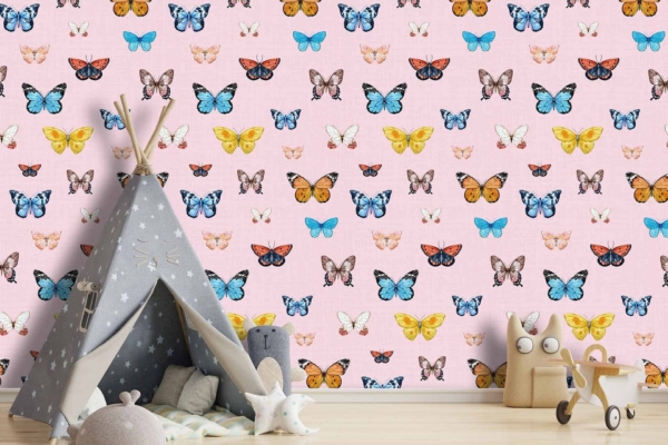 The light pink wall features multicolored butterfly wallpaper. The butterflies are in various hues, adding a whimsical touch to the room.