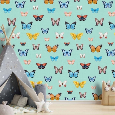 A children's room with a light blue wall adorned with colorful butterfly patterns.