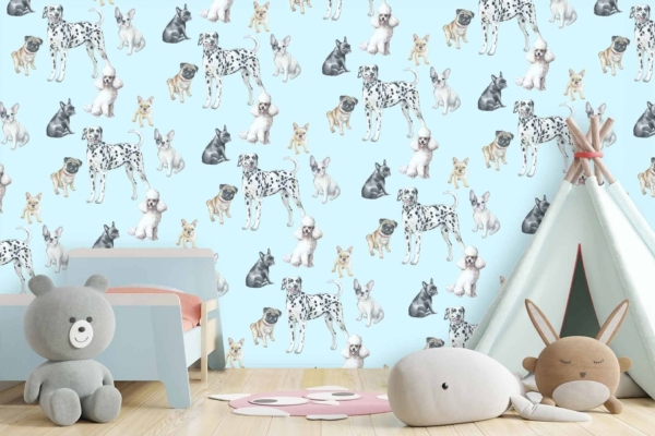 The wallpaper in the children's room showcases various dog breeds on a light blue background. It features colorful dogs including Dalmatians, Poodles, Beagles, Bulldogs, and French Bulldogs. Some dogs wear accessories like red bandanas, green collars, or yellow hats. The design includes paw prints and small bones scattered between the dogs to enhance the playful theme. The overall palette consists of pastel shades with pops of red, green, yellow, and brown against the soothing light blue backdrop.