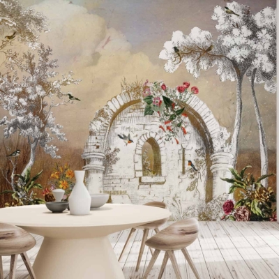The wallpaper features a weathered stone archway, surrounded by lush trees, vibrant flowers, and various birds. Set under a cloudy sky, the color palette includes earthy browns and grays for the stone, rich greens for the trees, and splashes of colorful hues for the flowers and birds. Light streaming through adds a serene glow to the scene.