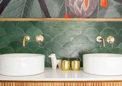 The wallpaper in the modern bathroom features a large, intricate botanical mural with detailed leaves and flowers. The design includes lush green foliage and colorful floral elements, making it an eye-catching piece for any interior design portfolio.