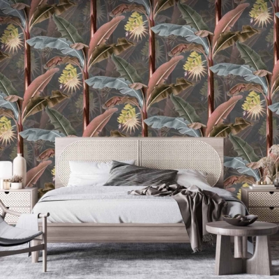 The wallpaper showcases a vibrant tropical leaf and flower pattern with lively elements of green leaves, exotic blue flowers, and splashes of pink and yellow hues. This colorful design contrasts beautifully against the neutral tones of the room.