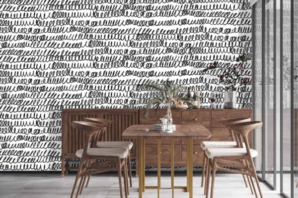 The wallpaper features a black and white color scheme with an artistic looped scribble pattern.