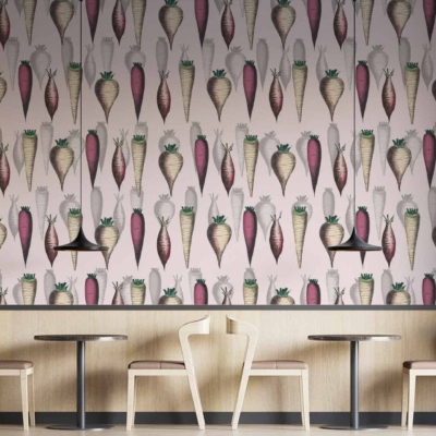 The wallpaper features vibrant carrot-shaped designs with lush green tops, creating a whimsical yet natural feel reminiscent of Nottingham Forest greenery. The carrots are placed against a light background, highlighting hues of orange, green, and subtle earth tones. This playful pattern breathes life into the contemporary space with its modern touch.