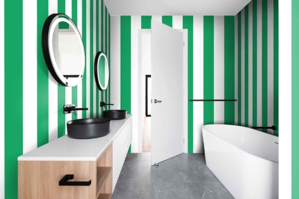 Modern bathroom wallpaper: The Right Stripe in green and white vertical patterns. Elements: green vertical stripes, white vertical stripes. Colors: green, white.