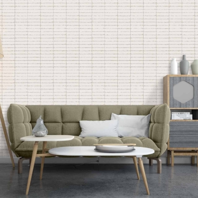 The wallpaper features a subtle geometric pattern in shades of light grey and soft white. It adds a modern yet understated elegance to the room, perfectly complementing the beige and white tones found in the furniture.
