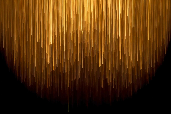 Abstract wallpaper with vertical golden streaks on a black background. Streaks vary in length, densely clustered at the top, and sparser towards the bottom, creating a cascading effect like golden rain or light beams. Colors: gold, black. Elements: vertical streaks, clustering pattern.