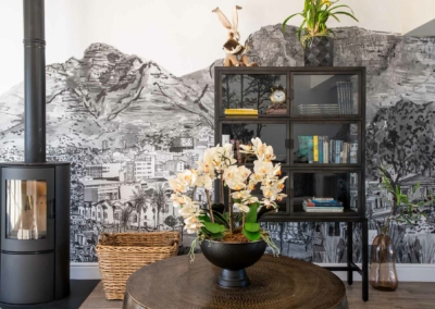 The wallpaper showcases a detailed black and white cityscape mural. It features intricate buildings, streets, and urban elements all depicted in fine monochromatic detail.