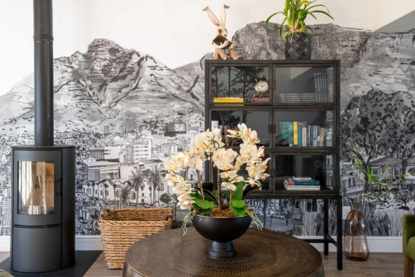 The wallpaper showcases a detailed black and white cityscape mural. It features intricate buildings, streets, and urban elements all depicted in fine monochromatic detail.