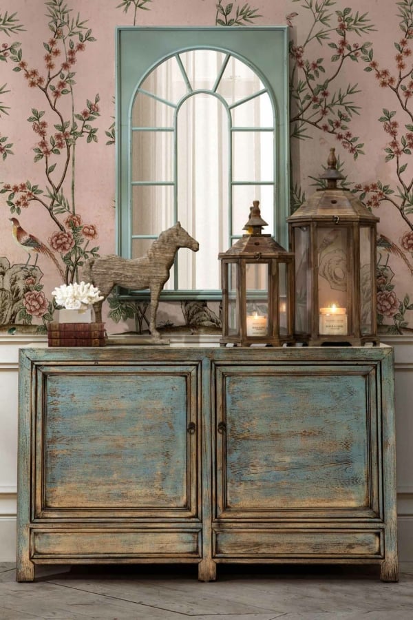 The wallpaper features intricate floral patterns with hues of soft pink, creamy white, and gentle green intertwined on a delicate blue background.