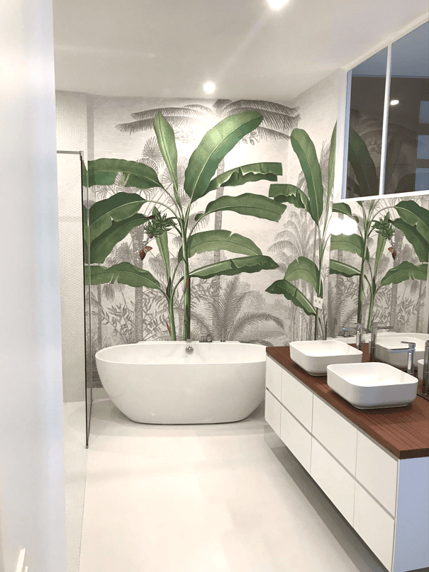 Wallpaper in the bathroom with a bathtub and basin