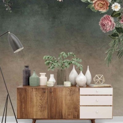 A green and faded floral wall mural.