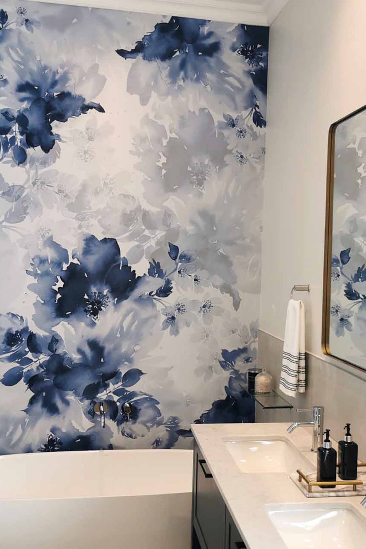 LANDSCAPE-IMAGES-ABGE-MAIN-EN-SUITE-CS-2021-1 Forest of Friends is a wallpaper that has been installed in a bathroom. There is a cabinet with a white basin in the room.