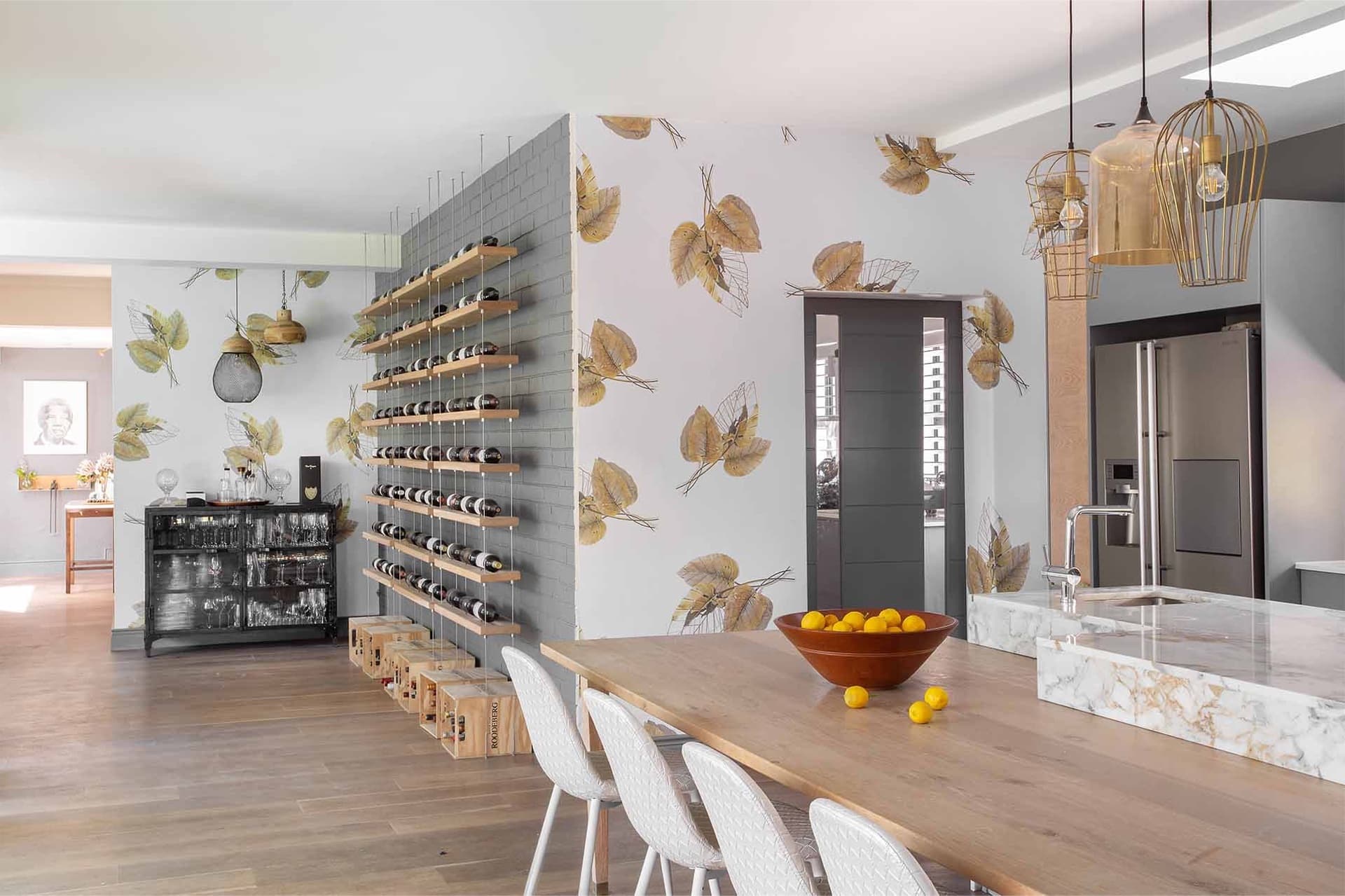 Layer 1 Botanical wallpaper adorned with lush green leaves, vibrant tropical flowers in hues of pink, yellow, and red. Birds and butterflies in matching colors amplify the lively design. Hints of light blue sky and subtle shadowing add depth.