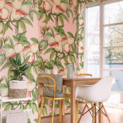 Vibrant wallpaper with a peach pattern featuring shades of orange, pink, and yellow hues against a light background.