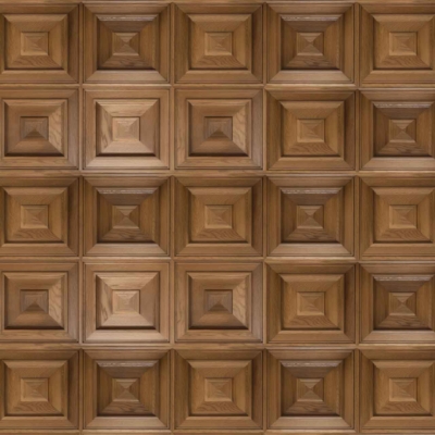 A wooden wall featuring repeating square panels, each with four concentric moulded squares arranged in a pyramid-like pattern for a 3D geometric effect. The natural brown finish highlights the visible wood grain.