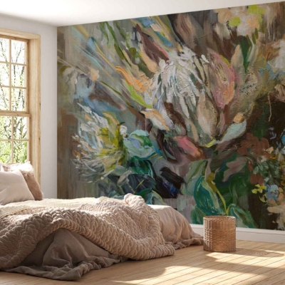 Floral mural wallpaper featuring large, vibrant blooms in shades of pink, orange, and red with lush green leaves. Subtle details include delicate tendrils and soft pastel accents. The background is a light cream color, providing a bright and airy feel.
