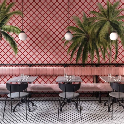 Red and white lattice-patterned wall, palm tree murals