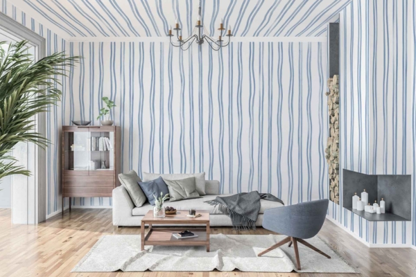 The living room showcases **blue and white wavy striped wallpaper with narrow lines**. The design features alternating waves of **blue** and **white**, creating a visually dynamic pattern that brings modern flair to the room.