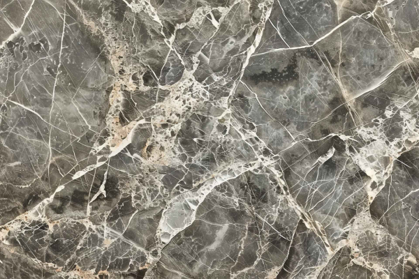 A detailed close-up view of a polished marble surface reveals a guided mosaic of interlocking gray, white, and beige veins. The natural stone texture features an intricate network of fine cracks and varying shades that add depth and character to the wallpaper. The subtle interplay of colors like pearly white, slate gray, and warm beige is prominent throughout the design.