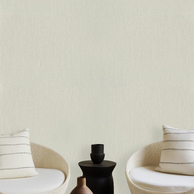 The wallpaper features a plain off-white color, serving as a minimalist backdrop that complements the modern living space. The neutral hue creates a serene atmosphere, allowing the room's furnishings to stand out. No intricate patterns or bold designs adorn this wallpaper; its simplicity enhances the elegance of the cushioned chairs, coffee table, and ceramic vases placed in the setting.