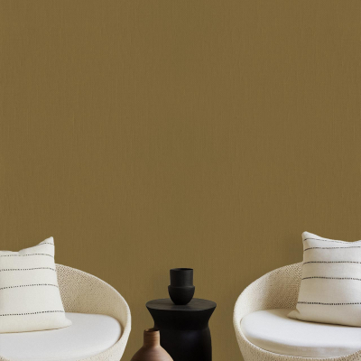 Olive-green wallpaper. White chairs with striped cushions. Small dark coffee table. Black, brown, and terracotta vases. Larger wooden table in the foreground. Minimalist living room design elements highlighted for search: olive-green wallpaper with complementary furnishings and decor colors (white, black, brown, terracotta).